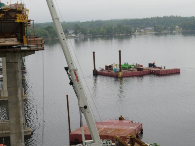 Moving the man lift barge in place for soffit work