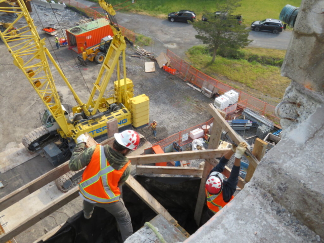 Removing the pier cap 14 railing for the girder installation