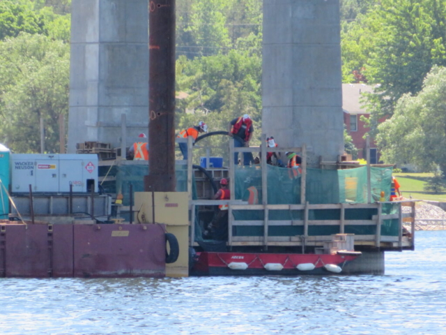 Placing concrete into the concrete forms on pier 6