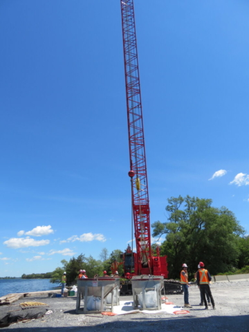 110 ton crane and hoppers, preparing for concrete placement