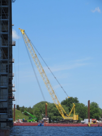 Barges, man lift and 200 ton crane set up at pier 4 for concrete placement