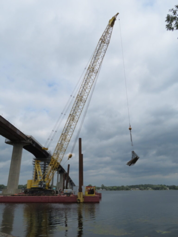 200 ton crane moving the brackets to the barge for installation