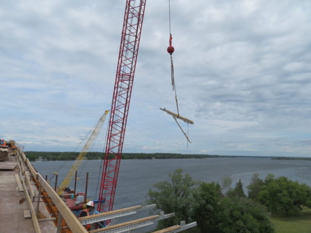 110 ton crane lifting the work platform brackets to be installed