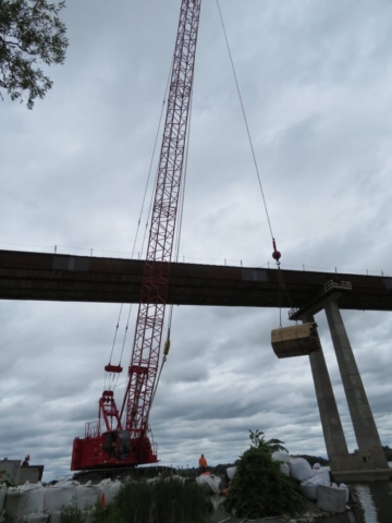 110 ton crane moving wood for the deck formwork