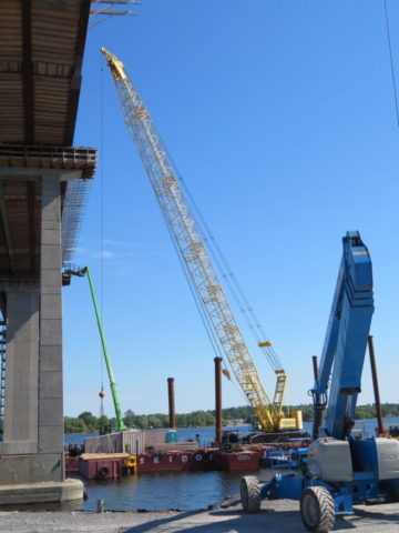 Overview of barges, crane and man-lift