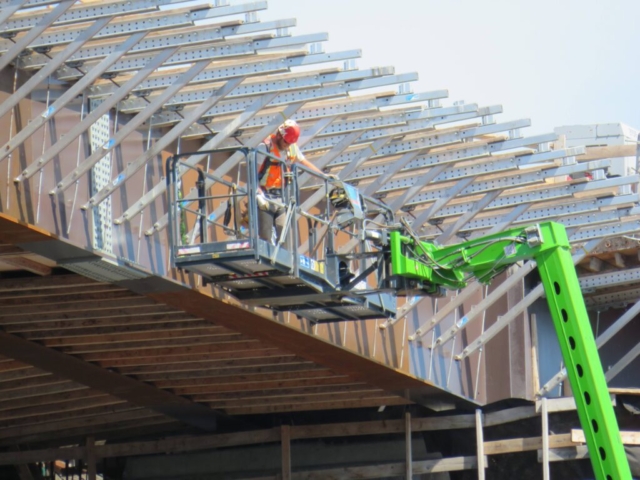 Close-up of installed brackets and man-lift