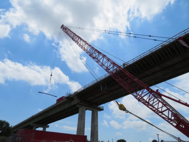 110 ton crane lifting rebar to the deck