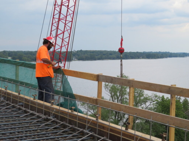 Installing containment netting on the work platform railing