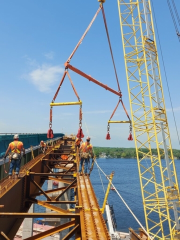 Removing the spreader bar from the installed approach girder