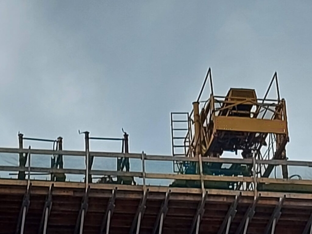 View from below of the concrete finisher and work bridges ready for the second concrete placement