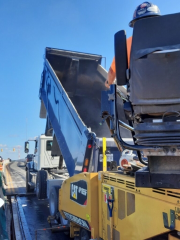 Filling the paver with asphalt