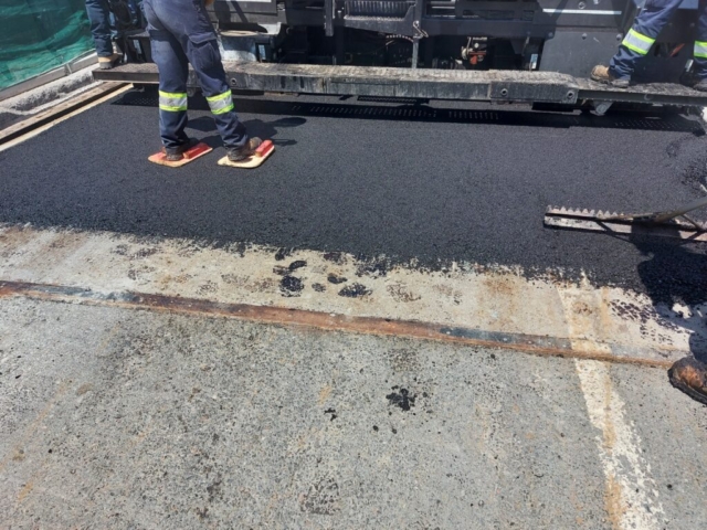 Beginning of mat for the first lift of asphalt