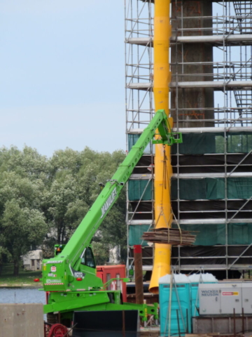 Man-lift moving materials on pier 10