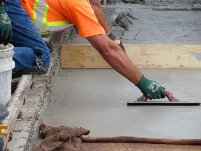 Finishing the newly placed concrete