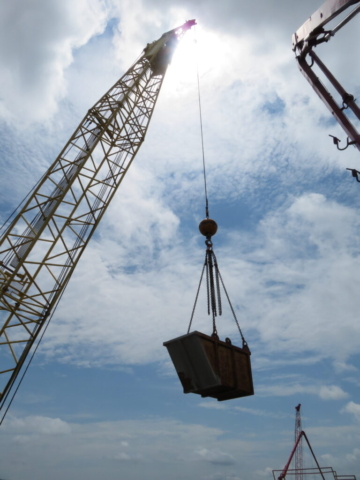 200-ton crane lifting the bin for concrete slurry