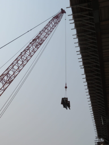 110-ton crane lifting the barrier wall formwork to the bridge deck