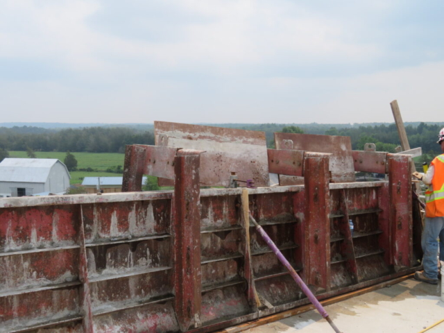 Close-up barrier wall forms, awaiting concrete placement