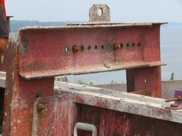 Close-up of newly placed concrete in barrier wall forms