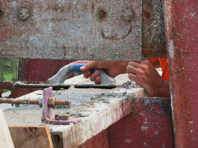 Close-up, troweling the newly placed concrete