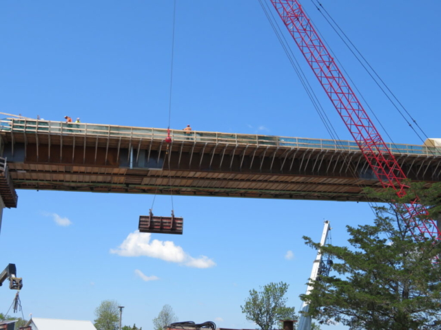 110-ton crane lowering the formwork from the deck