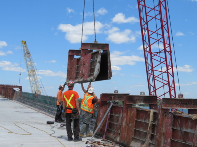 Lowering concrete forms for the next concrete placement