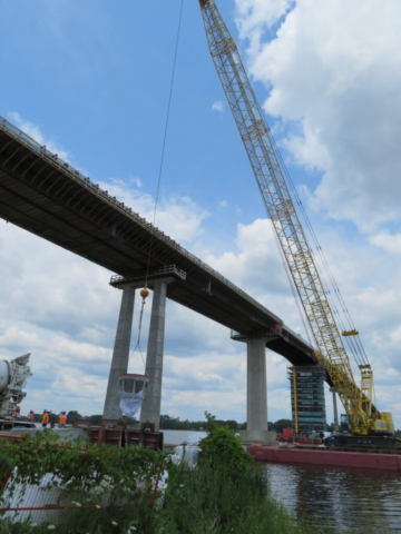 Overview, concrete truck, 200-ton crane lifting the concrete hopper