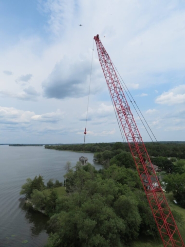 110-ton crane lifting a concrete hopper