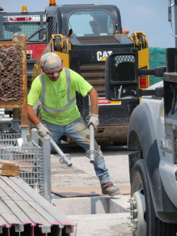 Handing down containment scaffolding materials into the false decking