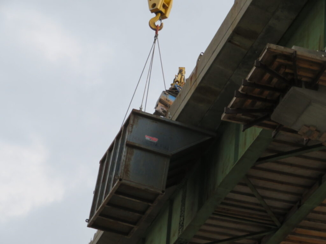 View from below of pulverizer and containment bin