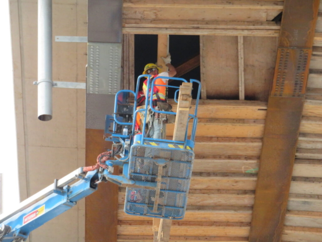 Using the Genie lift to remove the deck formwork