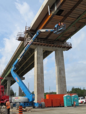 Expanded view of the Genie lift being used to remove formwork from the false decking