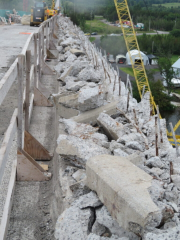 Close-up of barrier wall removal