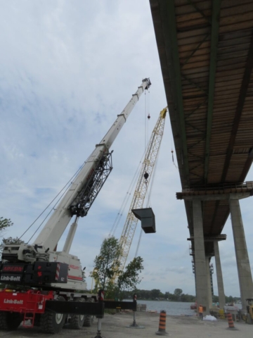 160-ton crane lifting the containment bin into place