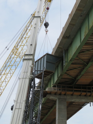 160-ton crane moving the containment bin into place