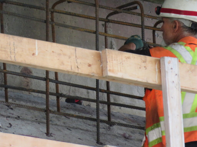 Installing dowels and rebar for the temporary concrete block on the south abutment