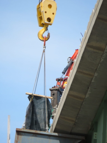 View from below of hoe0ramming and the containment bin