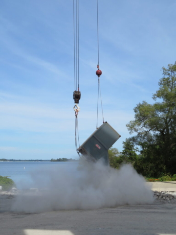 Emptying the containment bin of rubble to be sorted