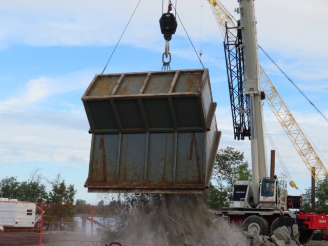 Close-up of the 160-ton crane dumping concrete rubble