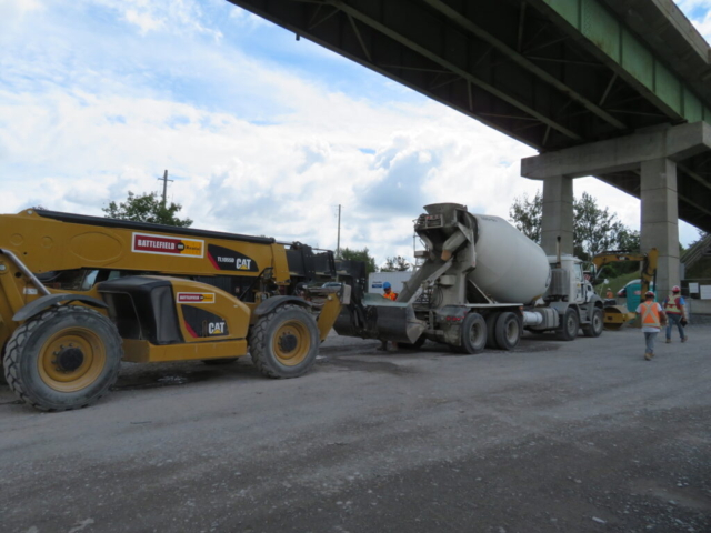 Placing concrete into the telehandler bucket