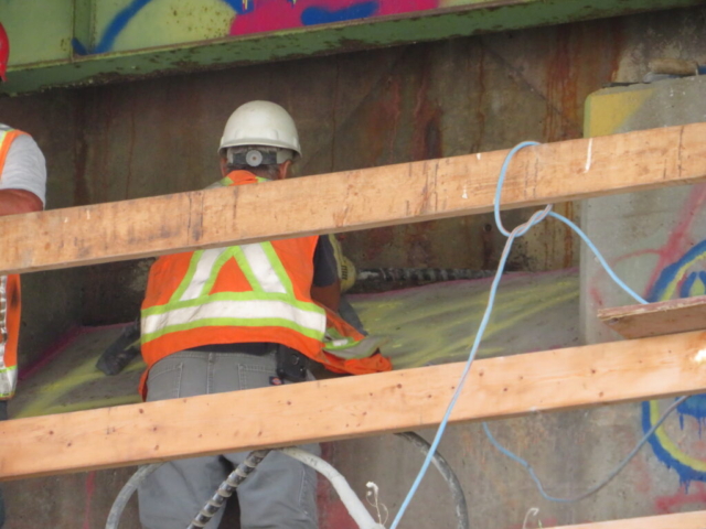 Vibrating the newly placed concrete on the south abutment