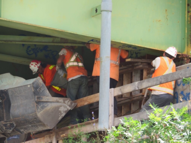 Placing concrete for the temporary shear block on the south abutment