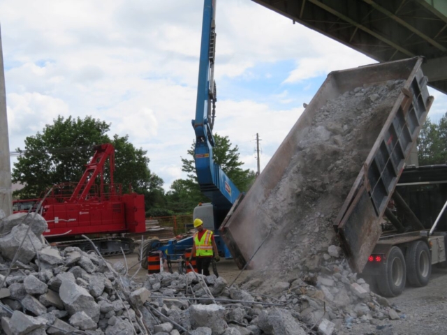 Offloading concrete rubble from the containment bin