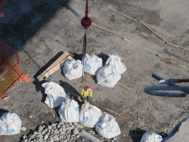 Removing the meter bags from the crane