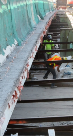 Cleaning excess concrete debris from the false decking