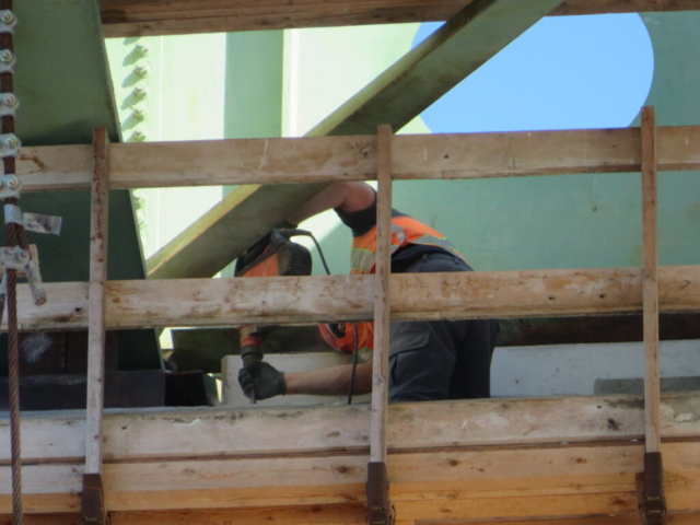 View from below of bush hammering on pier cap 12