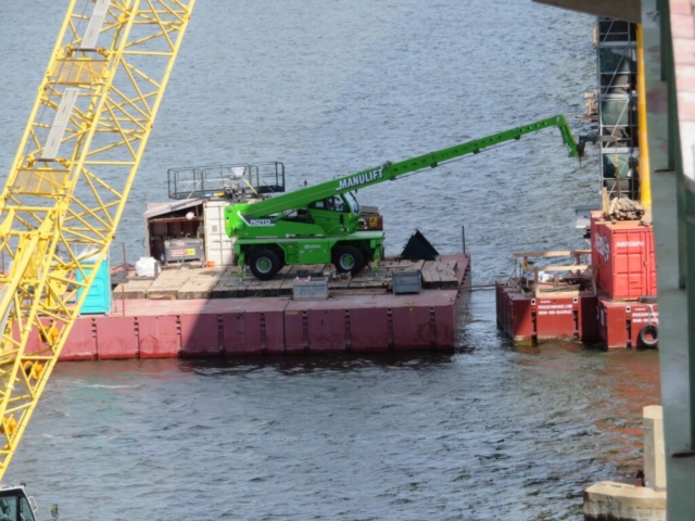 Using the manlift to move materials on pier 12