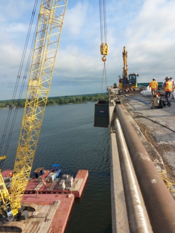 North view of cranes and barrier wall removal