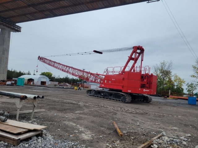 Preparing the 110-ton crane to be loaded onto the barge