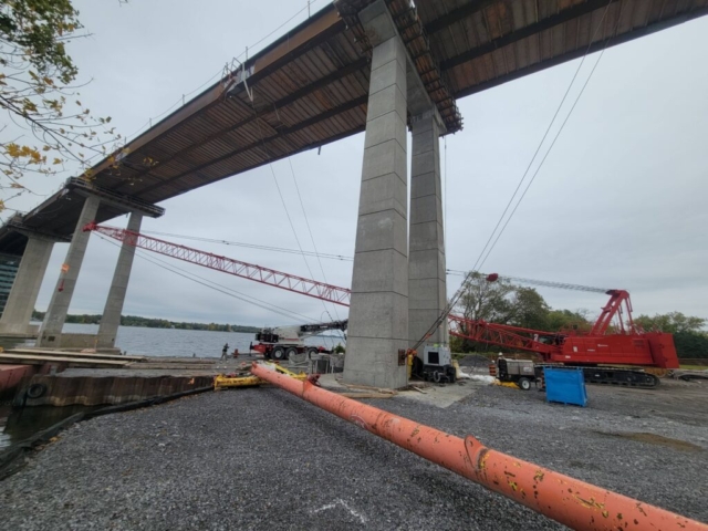 Moving the 110-ton crane into place to be loaded onto the barge