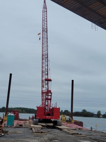 Loading the 110-ton crane onto the barge